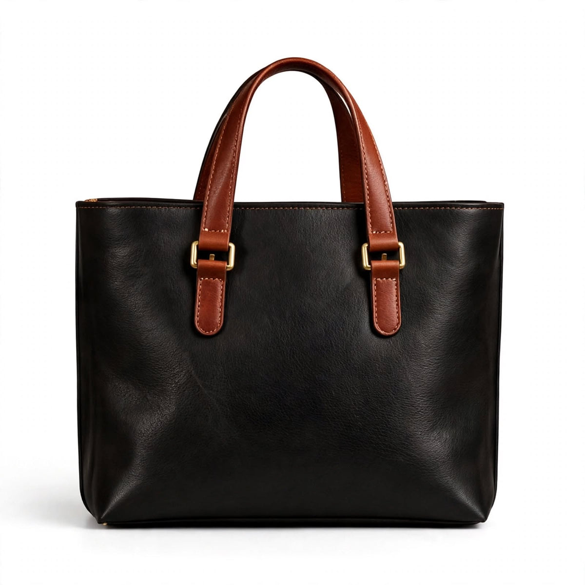 A black leather tote bag with brown leather handles and gold-tone buckle details, shown against a plain white background.