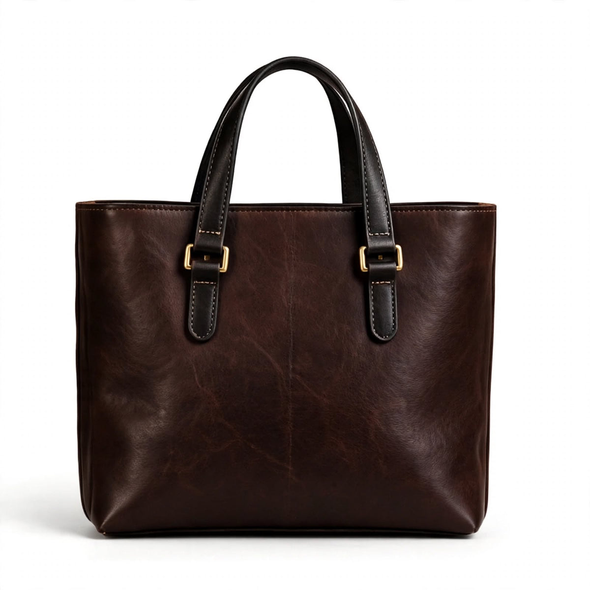 A dark brown leather tote bag with black leather handles and gold-tone buckle details, shown against a plain white background.