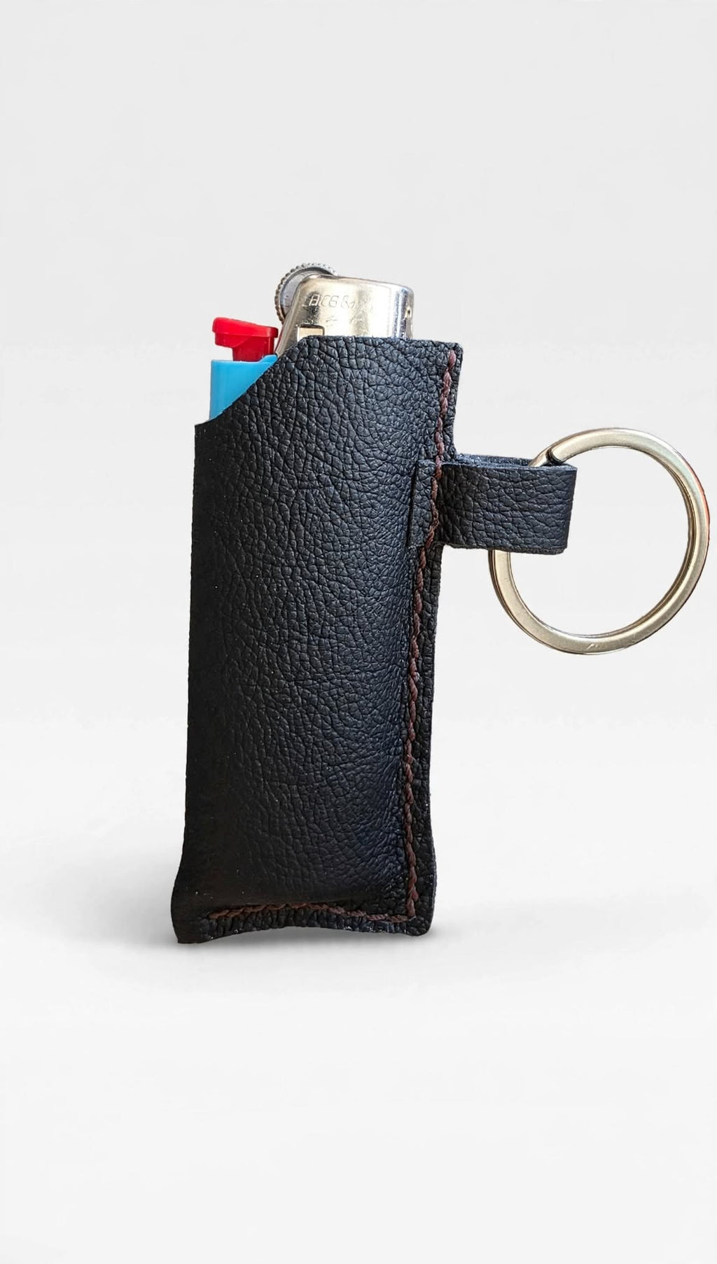 Black leather lighter holder keychain with Bic lighter - front view