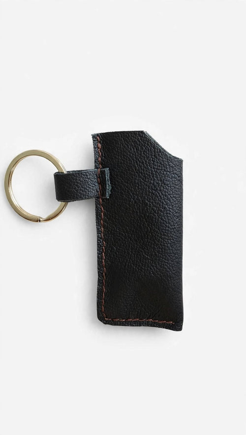 Leather Bic lighter case on white background studio shot